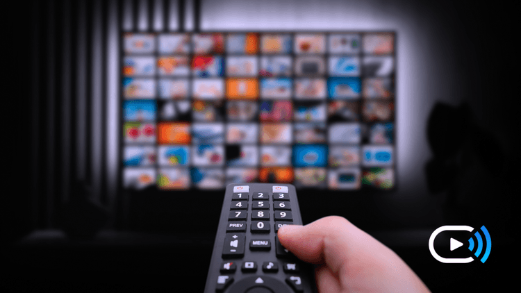 TV remote and Tv screen showing FreeCast's OmniChannel Streaming Platform which offers a unified, à la carte TV experience, eliminating multiple apps.